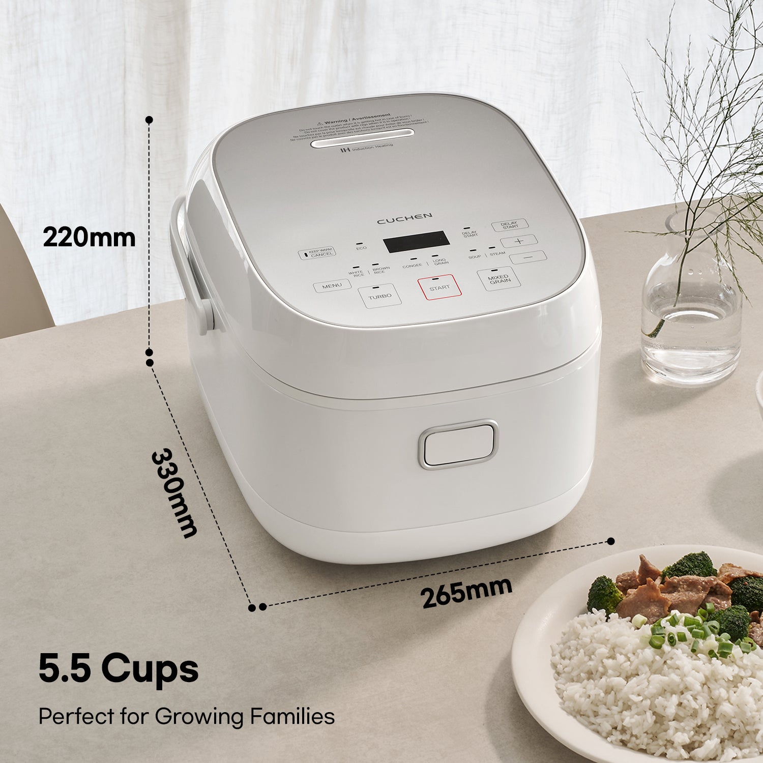 White rice cooker with dimensions and capacity details on a table with a plate of food.